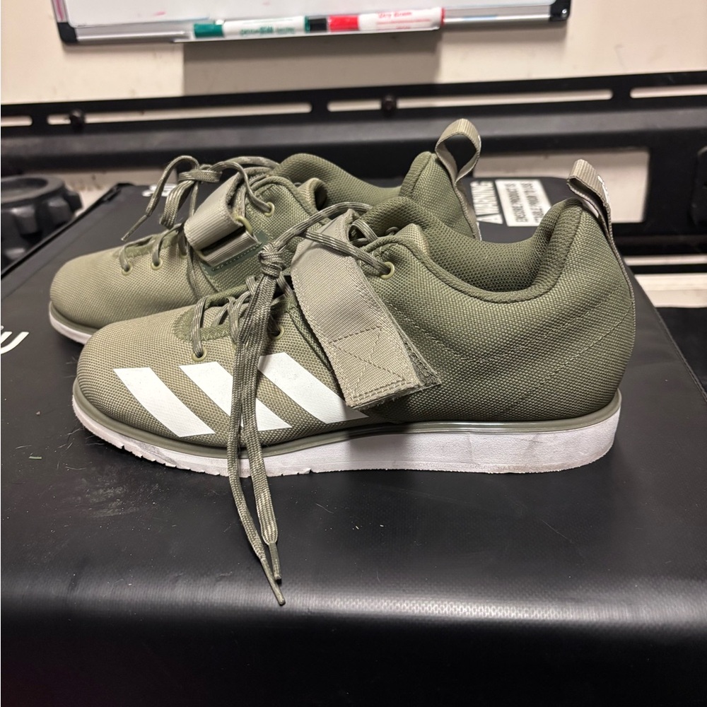 Women’s Adidas Green and White Lifters.